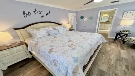 A luxurious master bedroom furnished with an oversized double bed