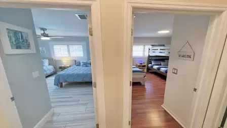 A harmonious view that leads gently into two cozy bedrooms, each with its own inviting charm