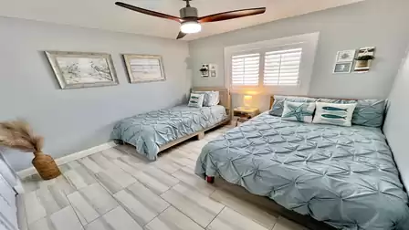 Cozy bedroom equipped with both a comfortable double bed and a single bed
