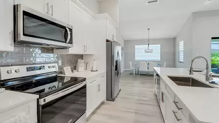 This elegant kitchen has a spacious kitchen counter