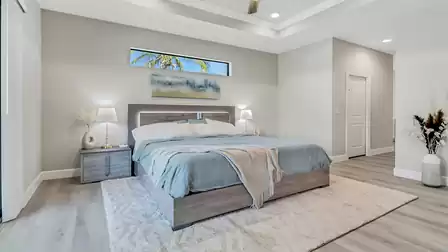 The master bedroom invites you in with an oversized double bed