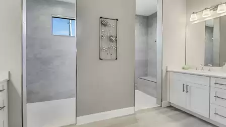 This inviting bathroom is equipped with an elegant walk-in shower