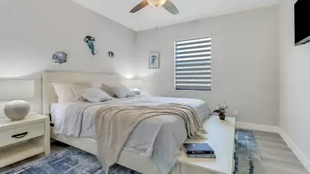 The second bedroom impresses with a large double bed