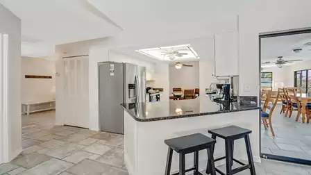 The modern kitchen is seamlessly integrated into the living area