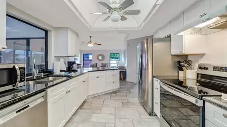 A spacious kitchen island offers additional space for preparing food