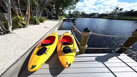 Close-up of two yellow kayaks on the dock - ready for the next adventure