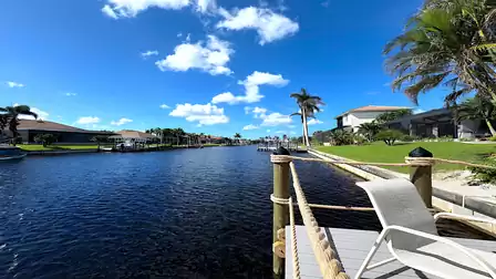 View from the dock of Villa Lavinia over the wide canal in Cape Coral
