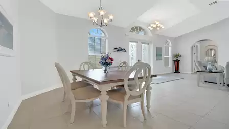 Open dining area with view of the entrance and living room