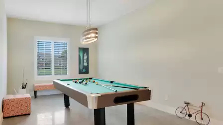 Stylish billiard table in a bright room with modern lighting.