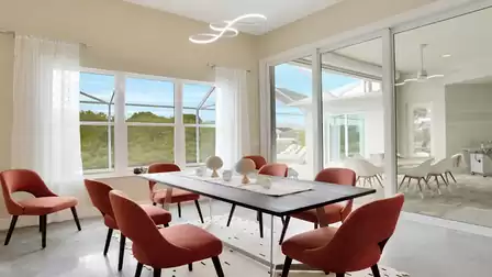 Elegant dining area overlooking the covered terrace and pool area.