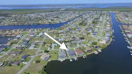 Overview with arrow indicating the canal location - perfect waterfront setting for boating.