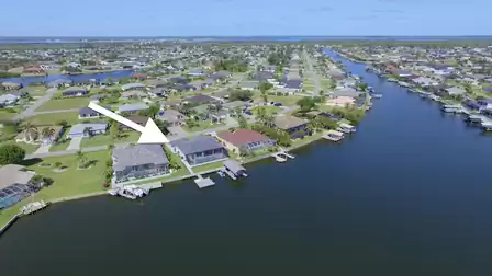 Aerial view highlighting the prime location on the wide canal - perfect starting point for boat excursions.