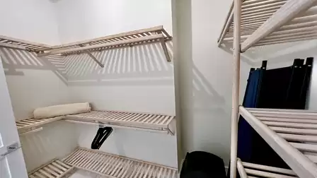 Walk-in closet with plenty of storage - perfect for organizing clothes and travel essentials.