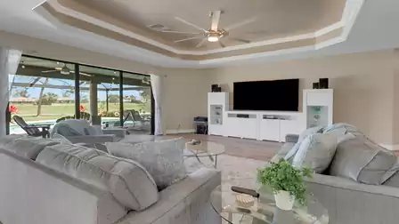 Large sliding glass doors open up the living area to the patio