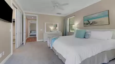 The third bedroom - also with a bright design - is furnished with a king-size bed