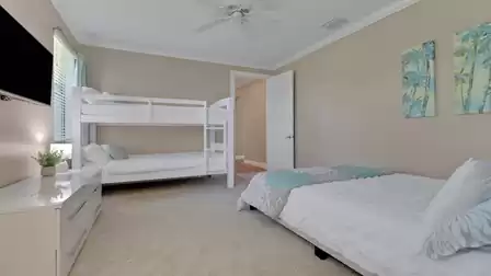 Family-friendly bedroom with queen-size and bunk bed, TV. Comfortably and brightly furnished