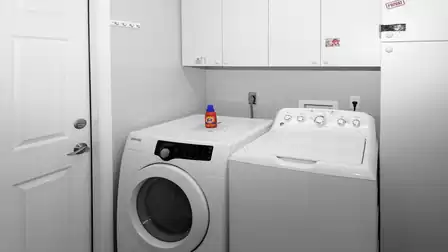 Utility room with washer and dryer for your convenience.