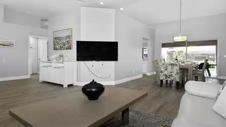 View from the living room to the dining area - flooded with light and overlooking the terrace and pool