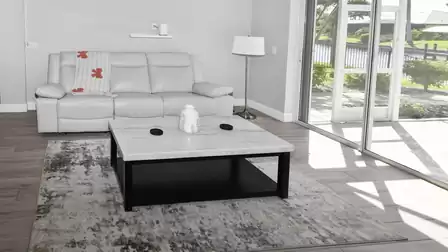 Bright lounge area with large sofa and direct terrace access – enjoy relaxing moments with a view of the water.
