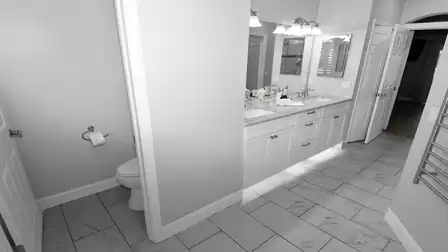 Practical master bath with separate toilet and spacious double sink – offering comfort and plenty of space for two.
