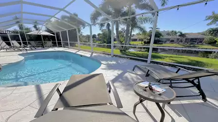 Sun loungers in the screened area by the pool