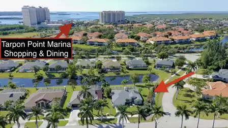 Aerial view of the residential area looking toward Tarpon Point Marina with nearby shopping and dining options.