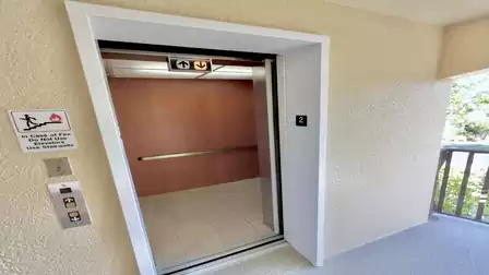 Elevator in the residential building with open cabin and floor indicator