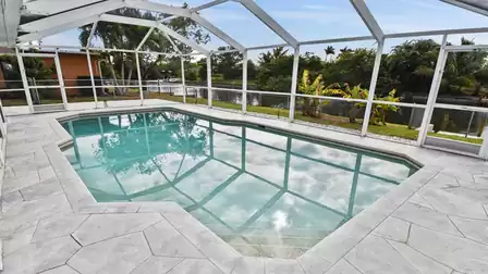 Screened pool area with water view, perfect for relaxing swim days in a quiet private setting