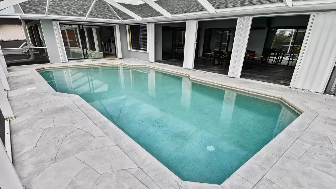 Direct access from living area to the pool creates a seamless indoor-outdoor vacation experience