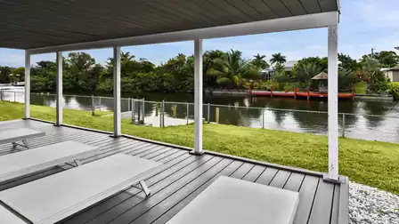 The covered terrace overlooking the canal is the ideal retreat for relaxing hours outdoors.