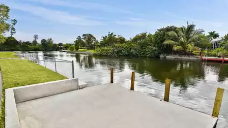 Calm freshwater canal with private dock, perfect for relaxing moments or easy kayak paddling