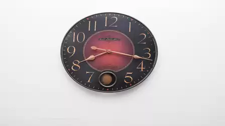 Decorative wall clock adds a stylish touch and enhances the calm, well-kept living atmosphere