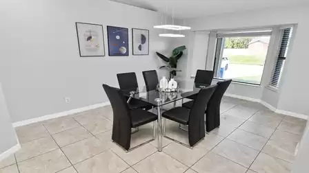 Modern dining area filled with natural light offers a pleasant setting for shared meals