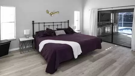 Master bedroom with king-size bed and direct access to the terrace