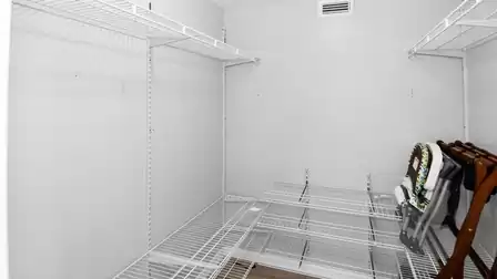 Spacious walk-in closet provides ample storage for luggage, clothing and longer stays