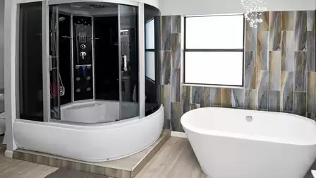 Spacious bathroom with shower and bathtub offers flexible options for relaxation and comfort