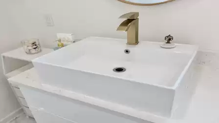Modern vessel sink with an elegant faucet and premium details in a stylish bathroom.