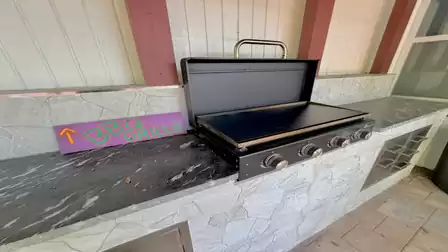 Spacious BBQ grill in the covered outdoor kitchen for relaxed cookouts in the tropical garden area