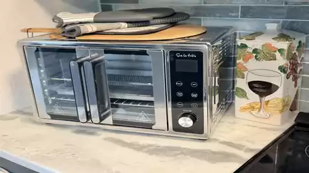 Well-equipped kitchen in the vacation villa featuring a modern countertop oven and premium workspace for easy meal preparation.