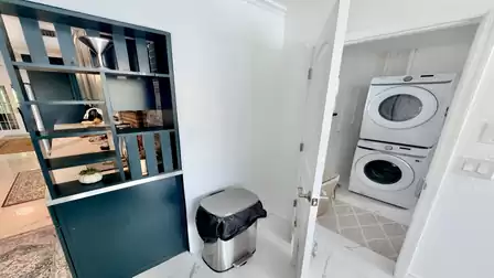 Convenient laundry room with modern washer and dryer - perfect for extended stays and a comfortable vacation with all the essentials.
