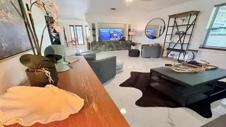 Stylishly furnished living area with comfortable seating, a smart TV, and an open-concept layout - an inviting space to unwind after a day of vacation adventures.