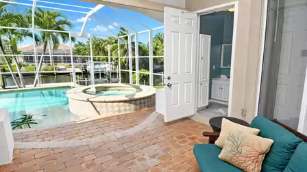 Villa Almare Cape Coral vacation home pool patio with raised spa and canal