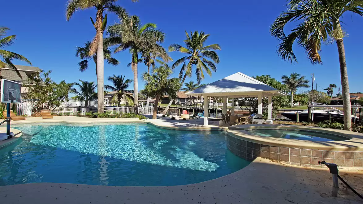 Villa Caladore vacation home in Fort Myers with freeform pool, spa and canalside gazebo