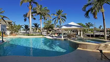 Villa Caladore vacation home in Fort Myers with freeform pool, spa and canalside gazebo