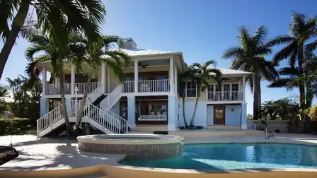 Two story house with raised porches, double staircases, pool and round spa