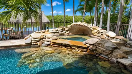 The pool offers a picturesque grotto