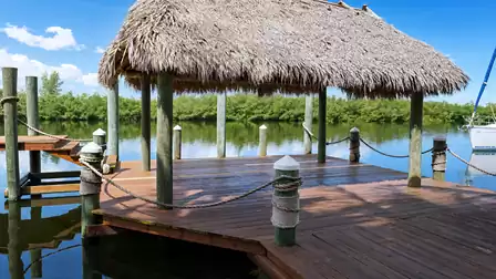Relax in the tiki and watch the boats on the canal