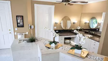 The stylish bathroom is held in light colors