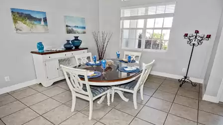The dining room is set up for four guests, but additional chairs are available