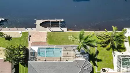 View from above of the pool and the canal with boat lift
